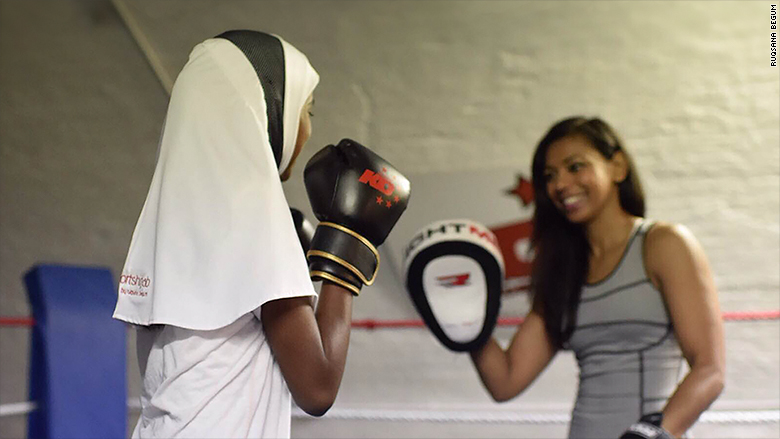 British champion muay thai fighter Ruqsana Begum (right) trains with a student wearing one of her sports hijabs. Photo: Ruqsana Regum