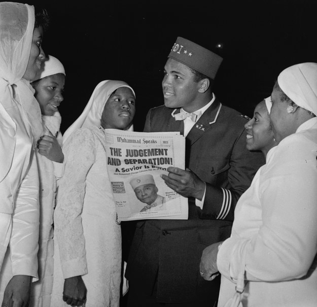 Muhammad Ali with members of the Black Muslim organization on Feb. 26, 1966, in Chicago. Ali converted to Islam in 1975. AP Photo