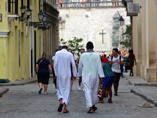 Ahmed Abuero (right) walks the streets of Old Havana with a Cuban Muslim convert, Ahmed, on June 22, 2016. Kamilia Lahrichi/Special for USA TODAY