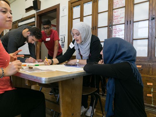 Jews and Muslims sponsored by the Jewish Community Relations Council and the Michigan Muslim Community Council come together to brighten Nolan Elementary-Middle School in Detroit, Sunday, September 18, 2016. Photo/Education Achievement Authority