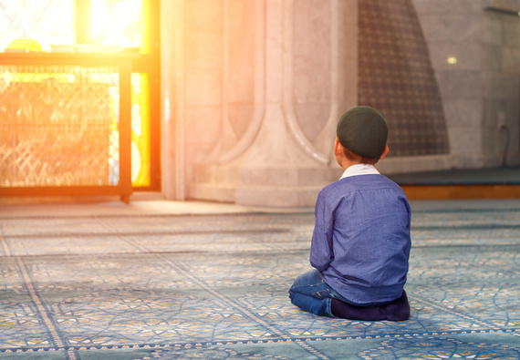 a little boy in the mosque